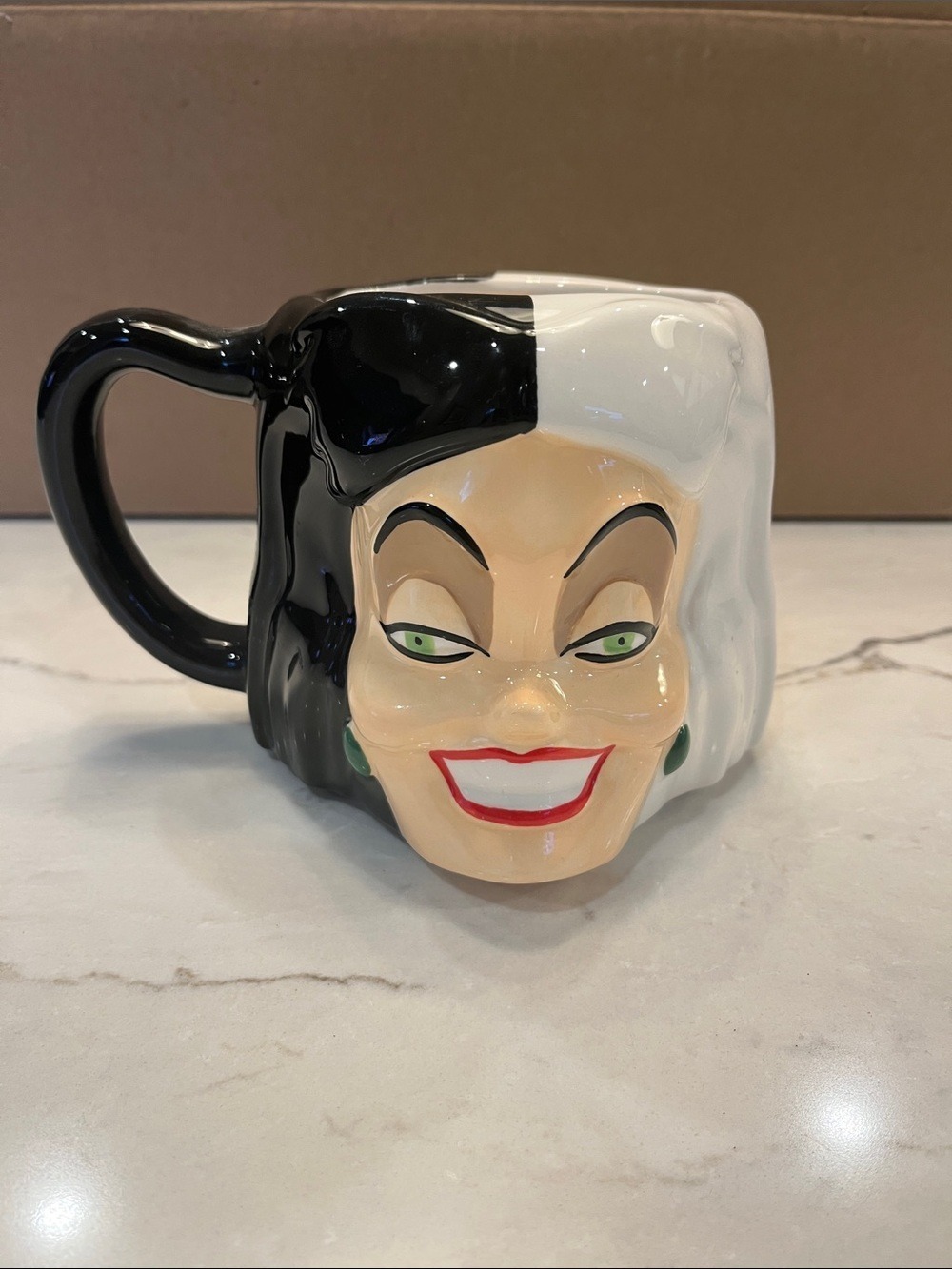 Bioworld Two-Tone Cruella Deville Villain Face Mug in Black, White, Red & Green